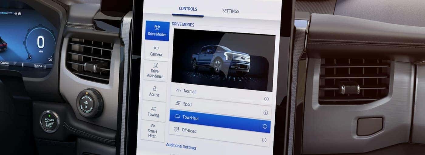 The interior of a 2022 Ford F-150 Lightning shows the infotainment screen.