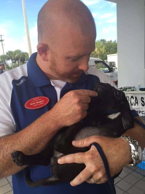 Man holding puppy