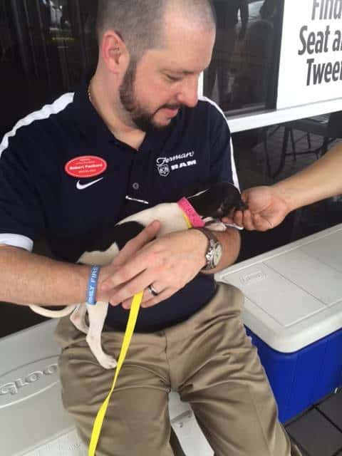 Man holding puppy