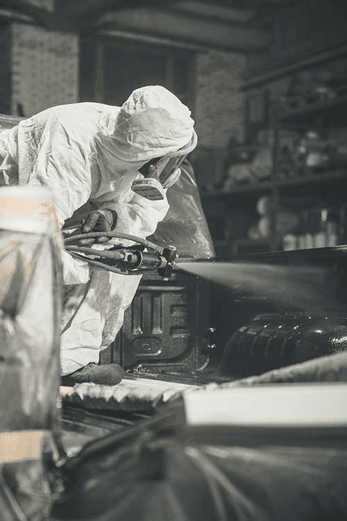 person-spraying-a-truck-bed