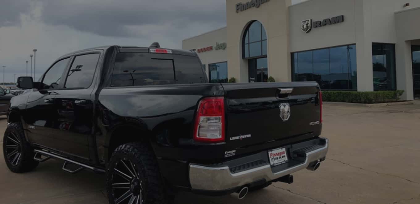 Black chevy truck outside of dealership