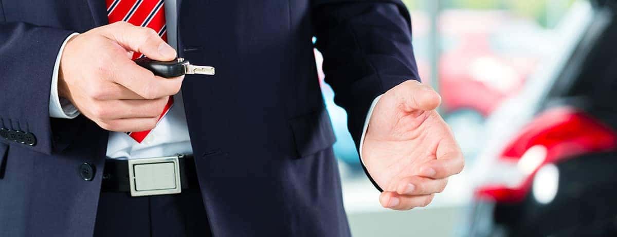 Person Holding Keys - Why Now is the Best Time to Buy a Car