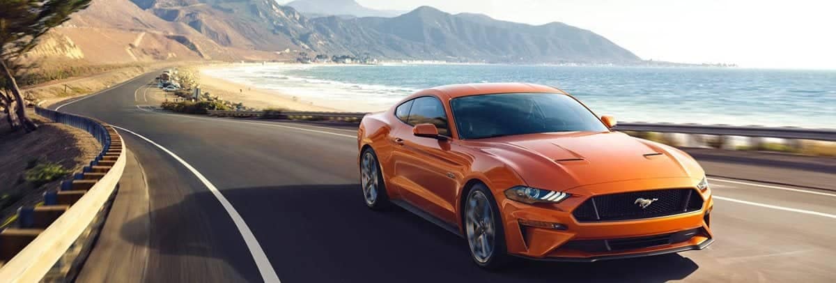 Ford Mustang driving on the road