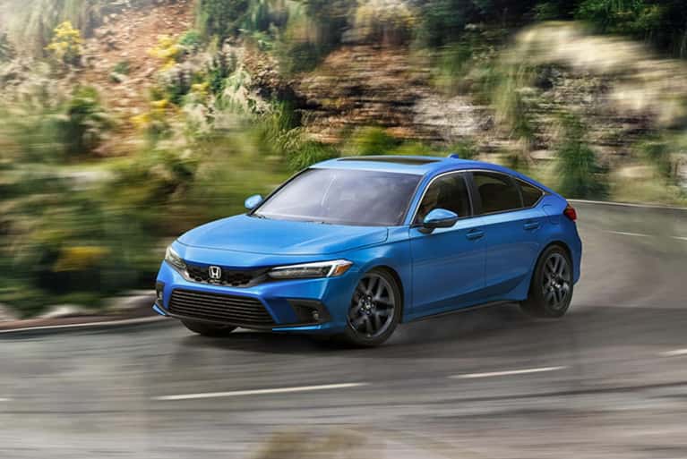 2024-honda-civic-sport-turning-tight-corner-on-a-mountain-road-mobile