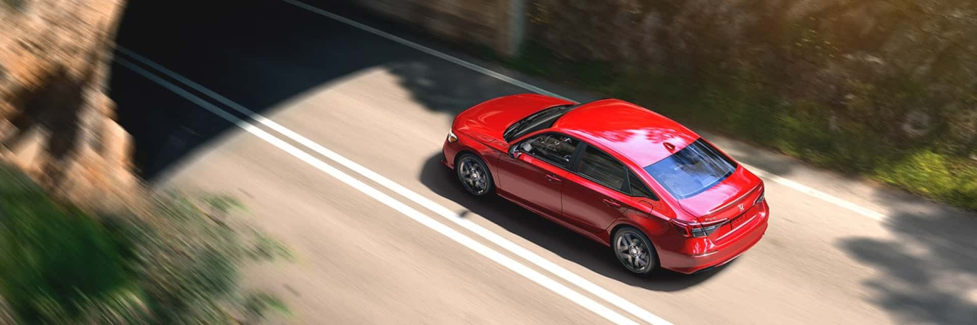 2024-honda-civic-touring-about-to-enter-a-tunnel-on-the-road