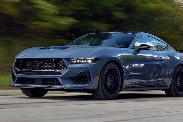 Two Mustangs driving along the highway_mobile