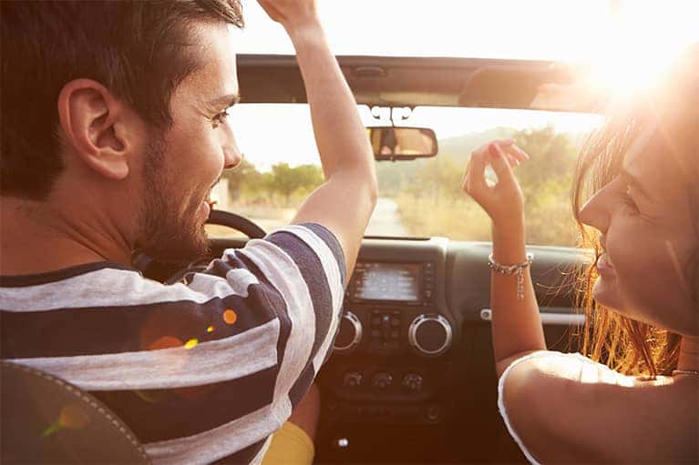 Man and Woman Driving in Car