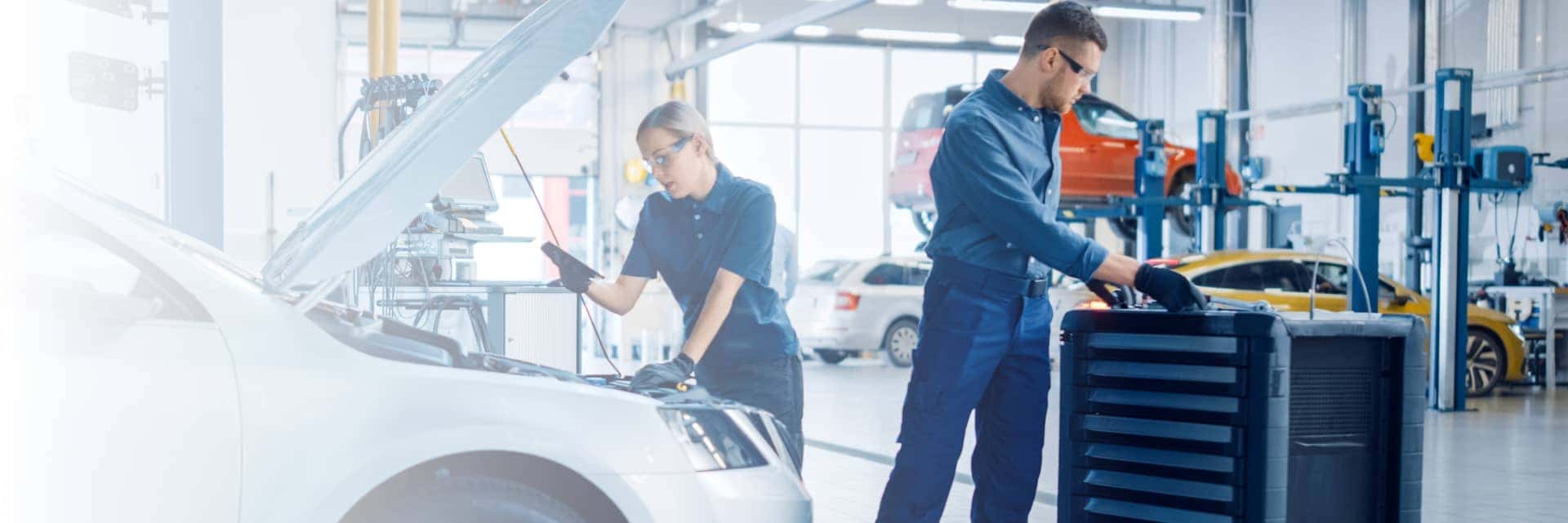 Service Technicians working on a car