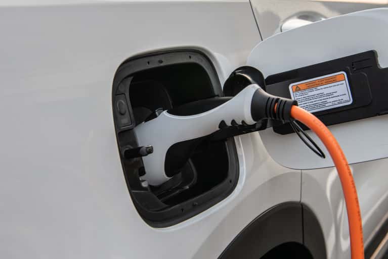 2024 electric kia sorento hybrid plug-in showing the plug in the side of the vehicle