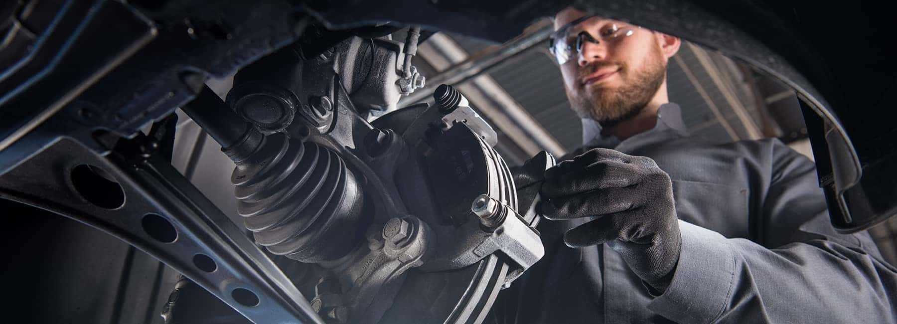 technician installs new brake pads