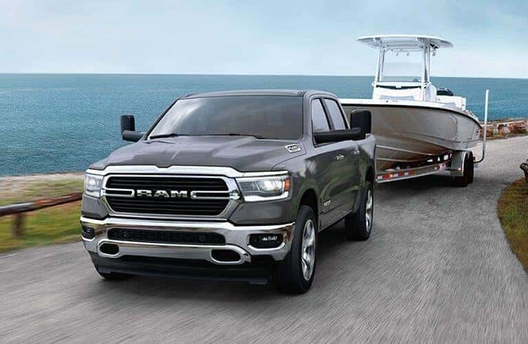 Exterior view of a gray 2020 RAM 1500 towing