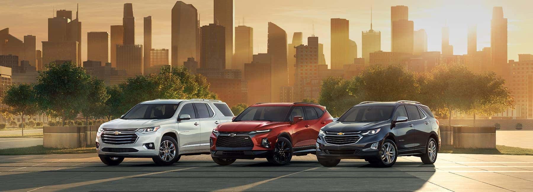 2020 Chevrolet Lineup Against A City Skyline At Sunset 