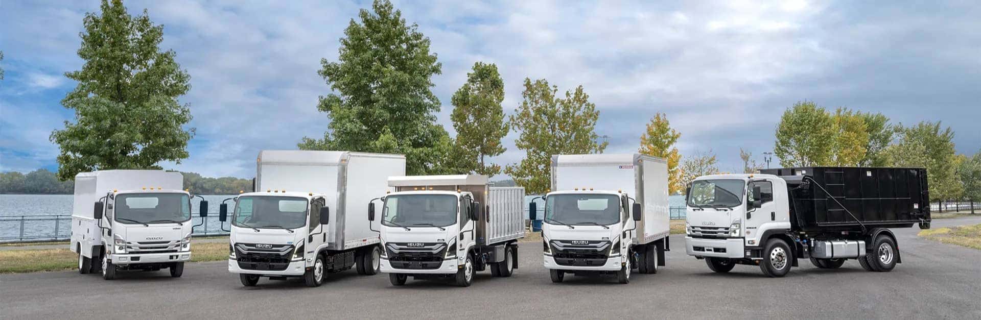 Isuzu trucks parked in a row