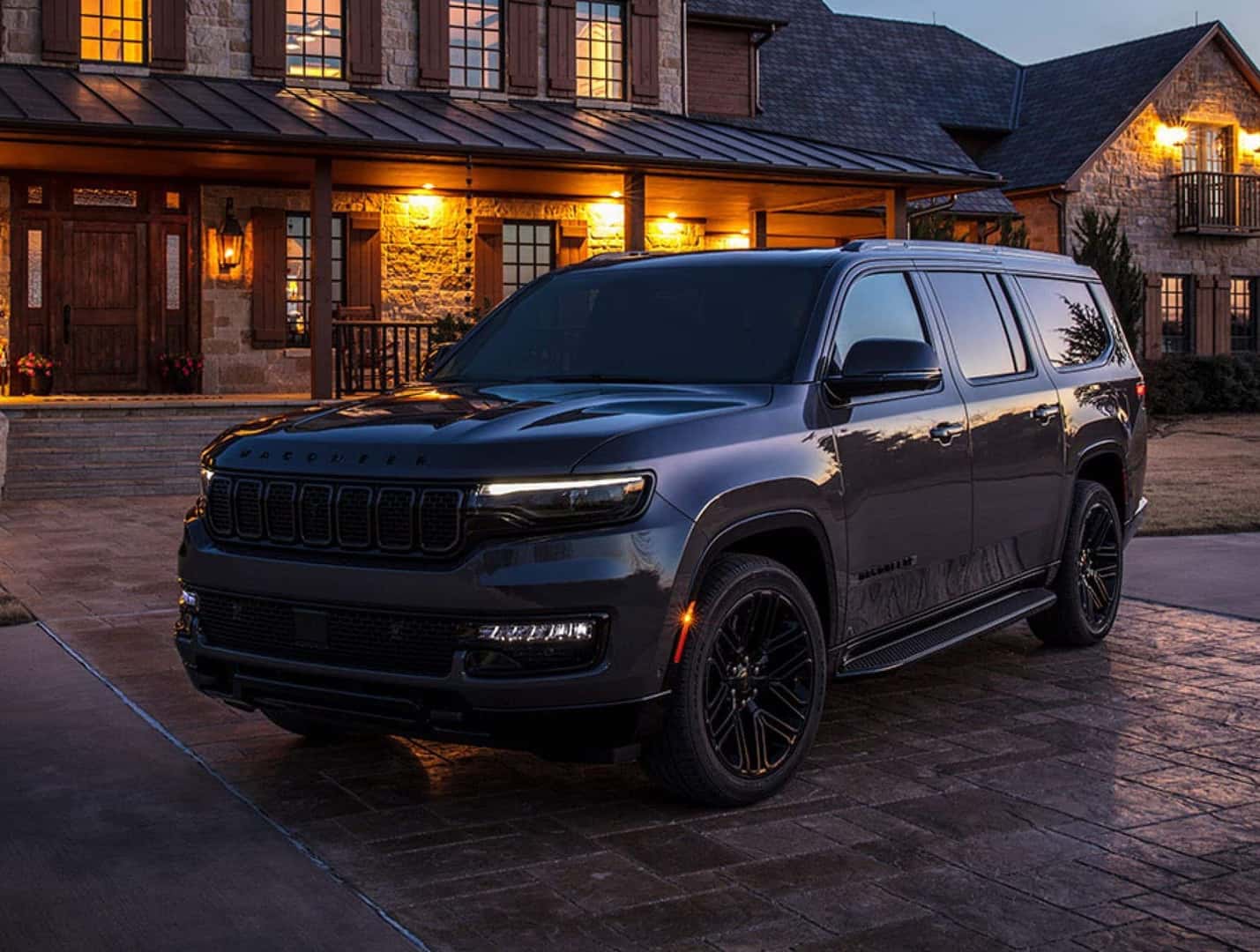 SUV-parked-in-front-of-lodge-at-dusk