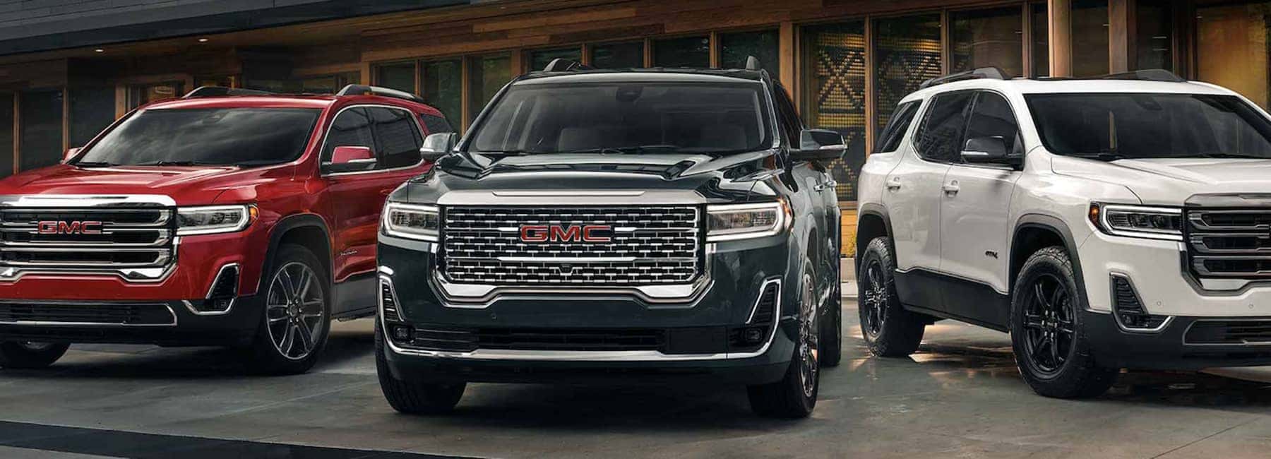Three-2023-GMC-Acadia-vehicles-parked_mobile