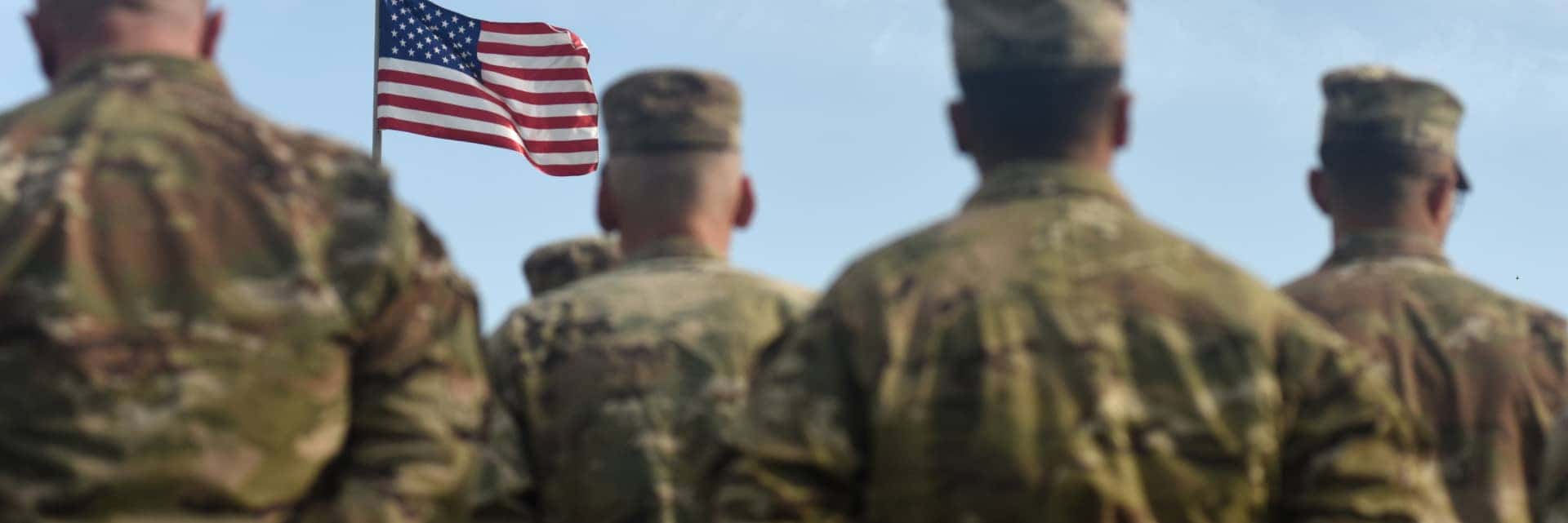 soldiers-looking-at-flag-mobile