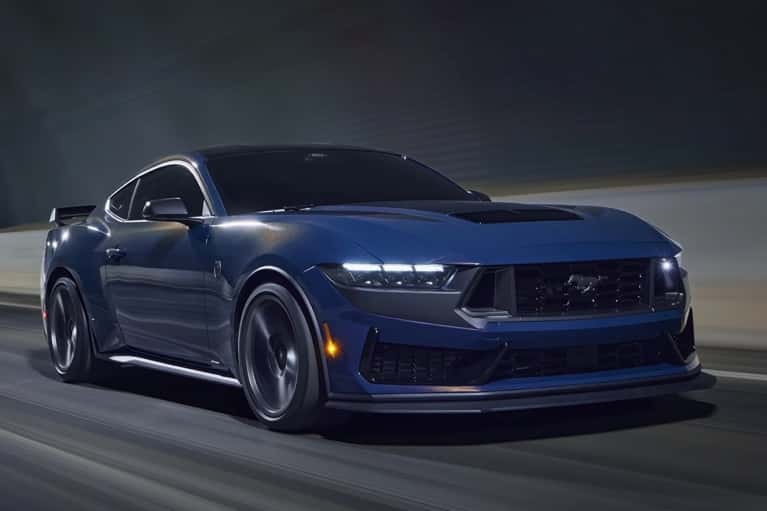2025-Ford-Mustang-speeding-through-a-dim-lit-tunnel---mobile