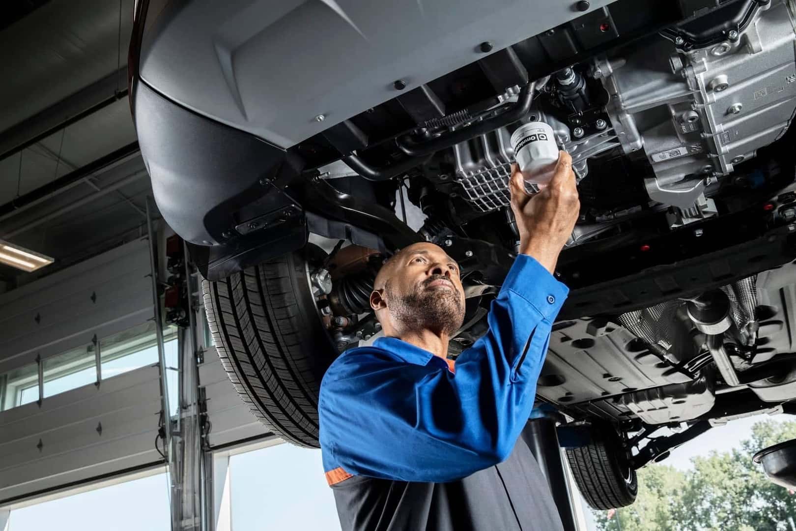 Mechanic looking at an oil filter