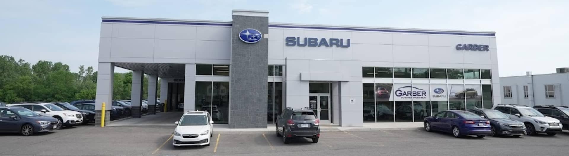 Outside of Garber Subaru Rochester dealership during the day