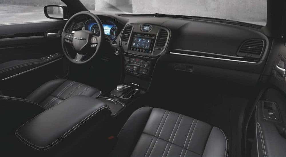 The black interior is shown in a 2023 Chrysler 300S.