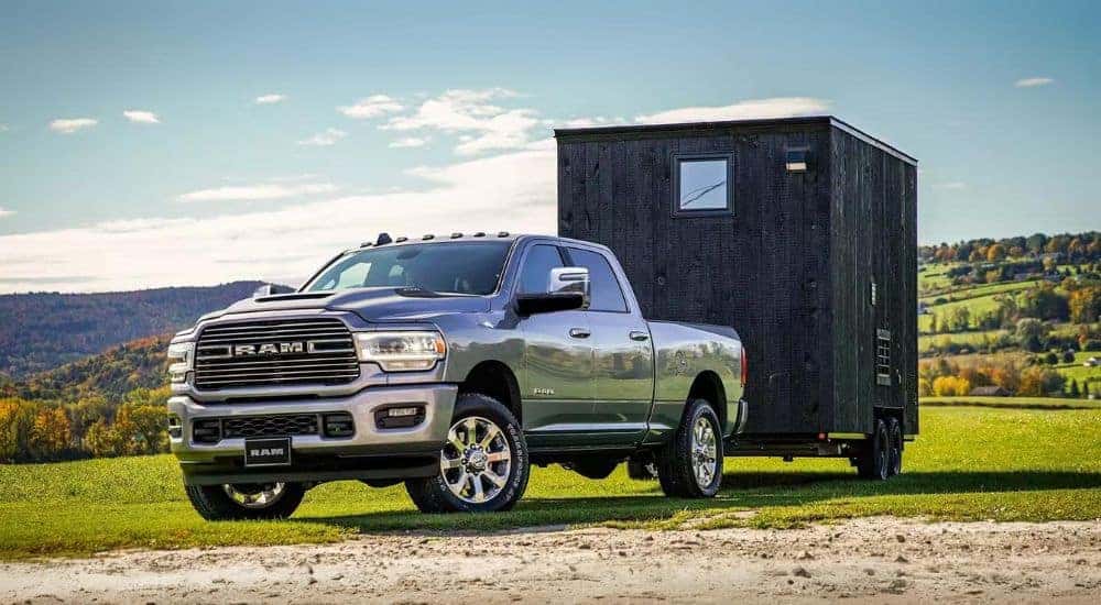 A grey 2024 Ram 2500 is shown parked on grass.