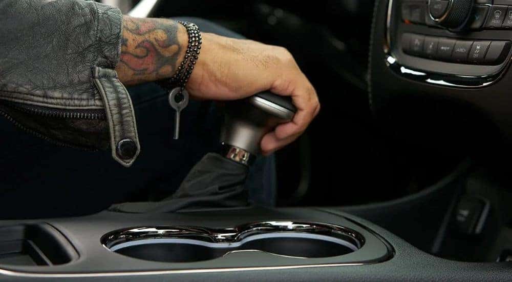 A close-up shows the shifter in a 2020 Dodge Durango.