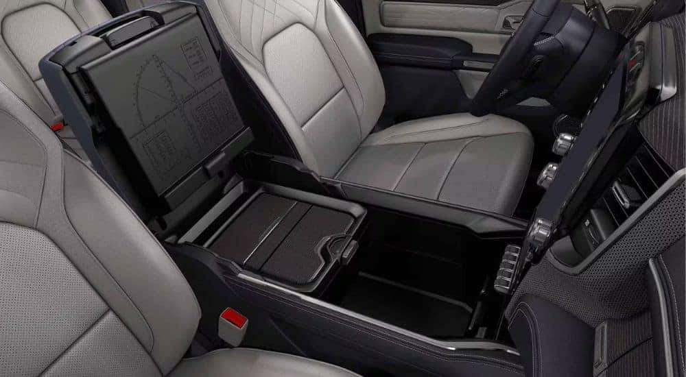 The open center console is shown in a 2024 Ram 1500.
