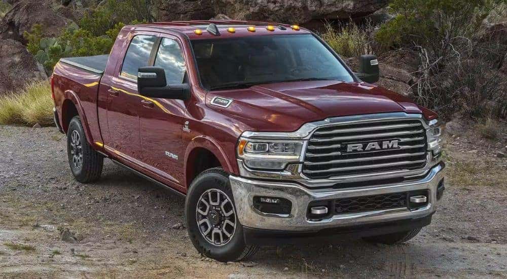 A red 2024 Ram 2500 is shown parked off-road.