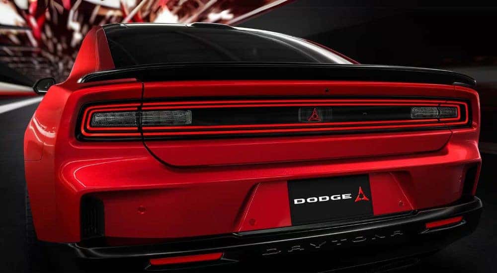 The rear end of a red 2025 Dodge Charger Daytona is show.