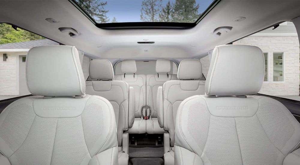A close up shows the grey leather seats in a 2023 Jeep Grand Cherokee L Overland.