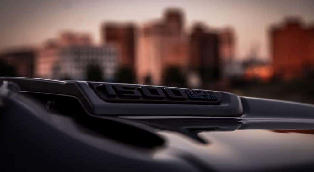 A close-up shows the eTorque badge on a black 2023 Ram 1500.