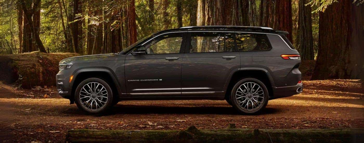 A grey 2024 Jeep Grand Cherokee L is shown from the side.
