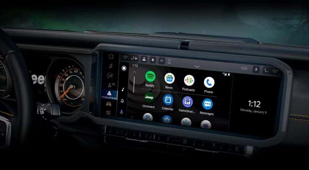 A close up shows the infotainment screen in a 2024 Jeep Wrangler.