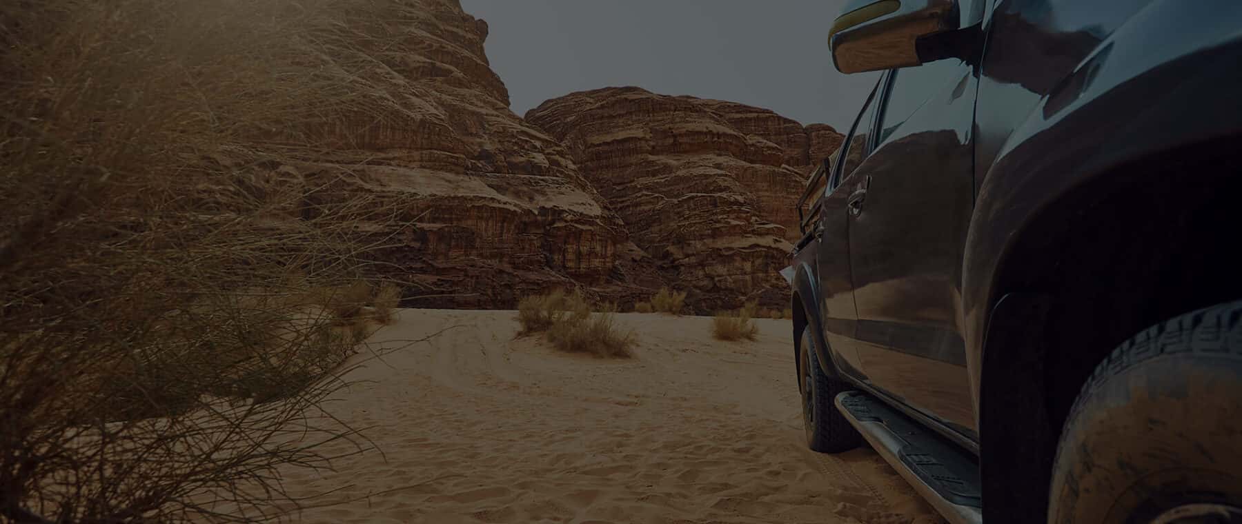 Vehicle in the Desert Sun