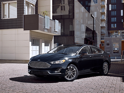 black ford fusion in apartment driveway