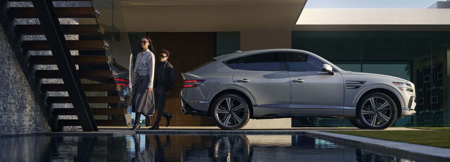 2026-Genesis-GV80-coupe-couple-exits-and-walks-to-their-home