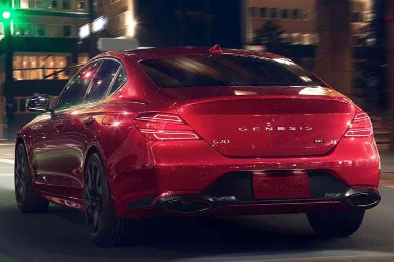 red-G70-drives-city-street-nighttime-mobile