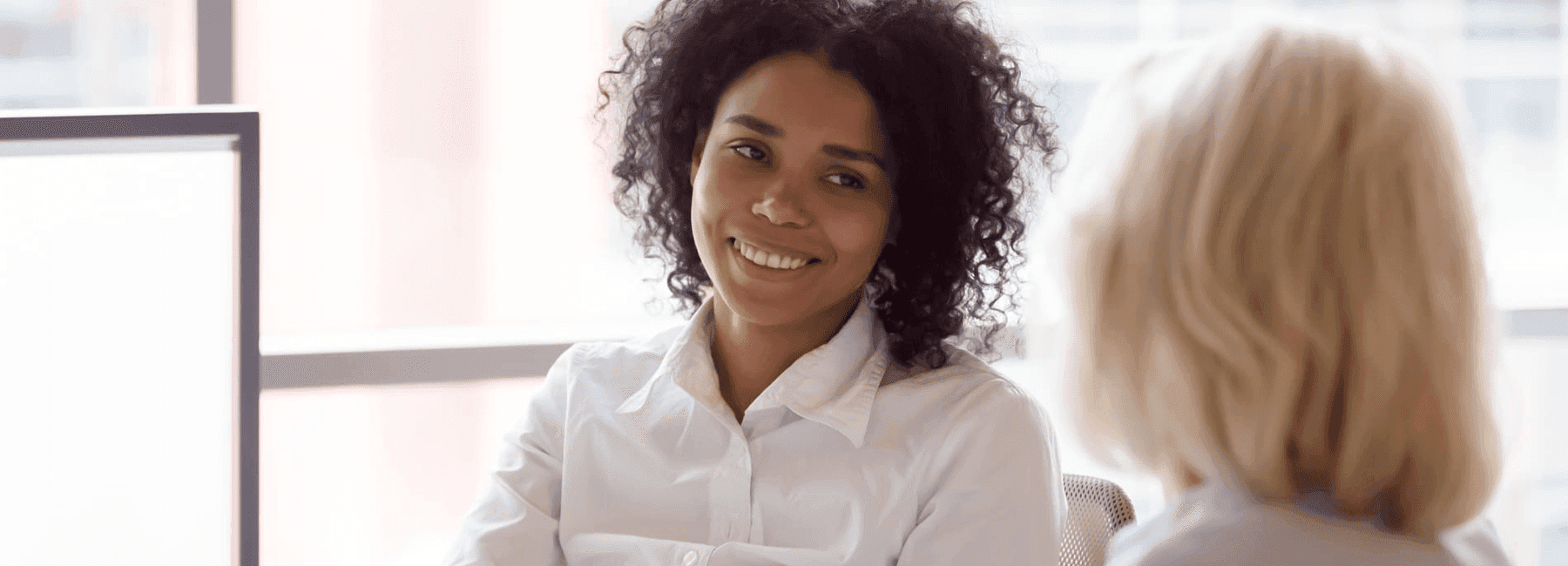 smiling customer meets with finance advisor