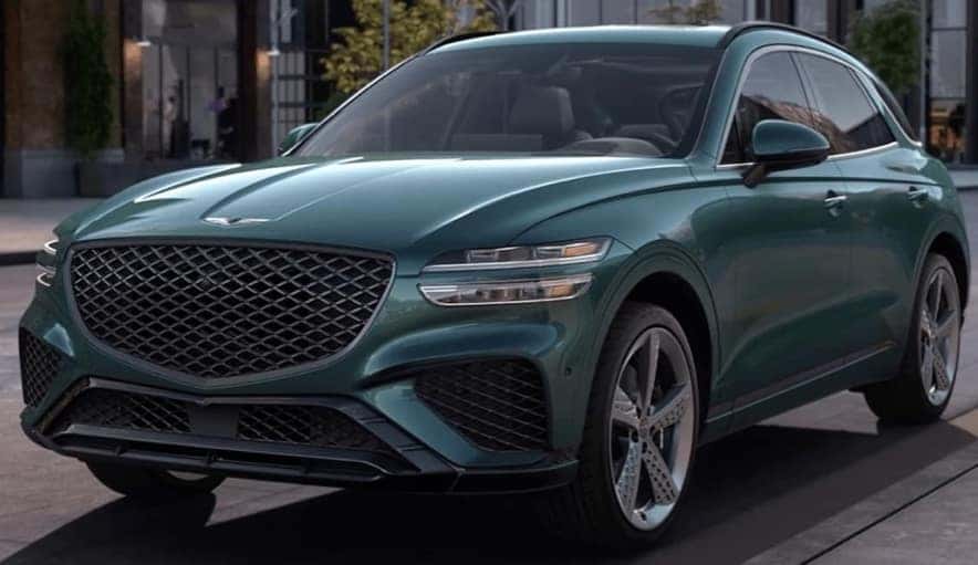 2023 green Genesis GV70 parked city street