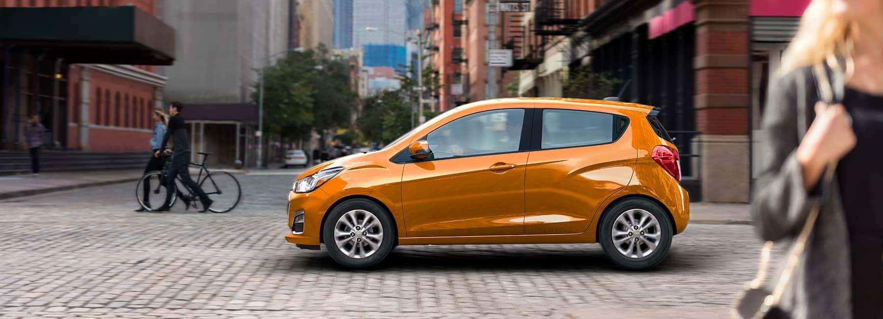Orange 2020 Chevrolet Spark on a City Street
