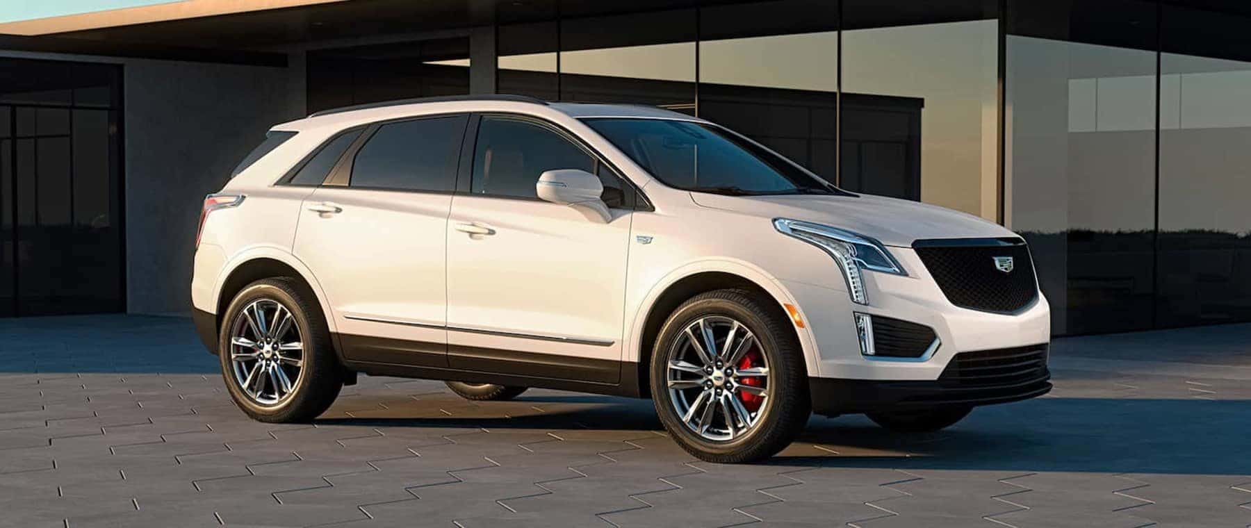 2023 Cadillac XT5 parked next to a building