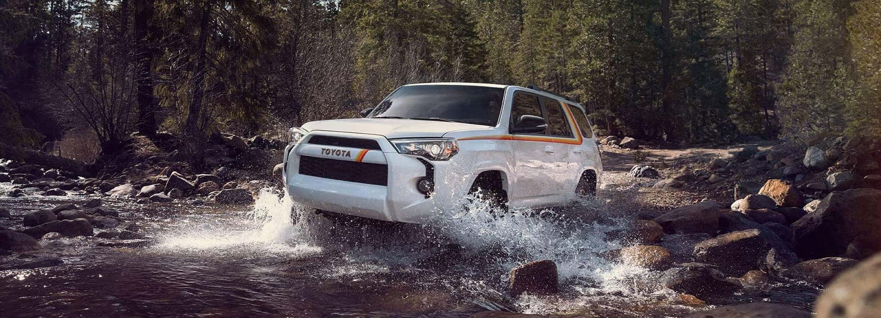 2023 Toyota 4Runner driving through creek