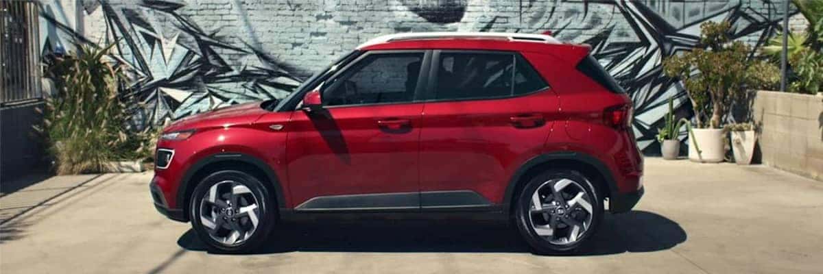 Sideview of a red 2020 Hyundai Venue