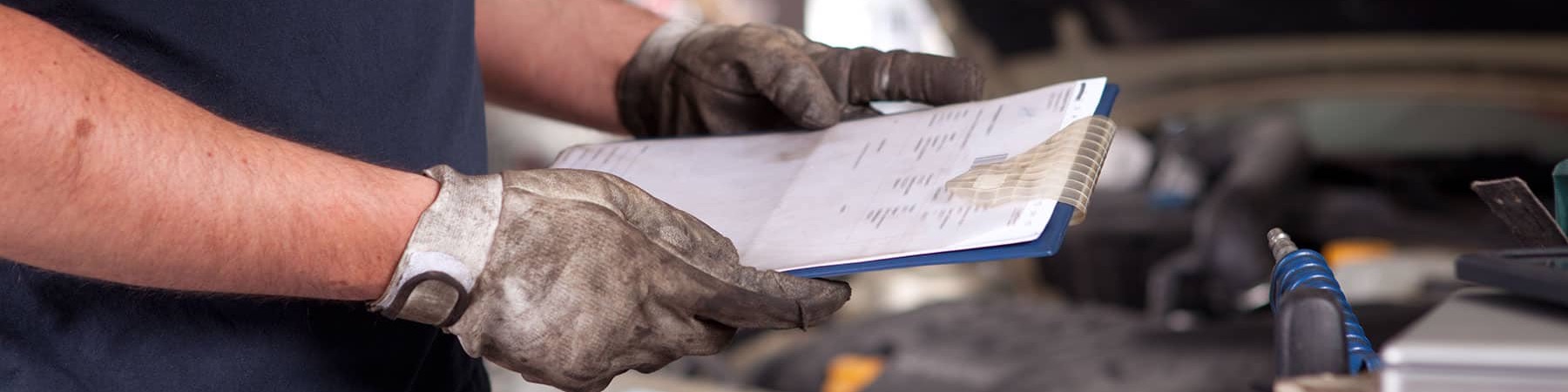 Mechanic with Vehicle Inspection Checklist