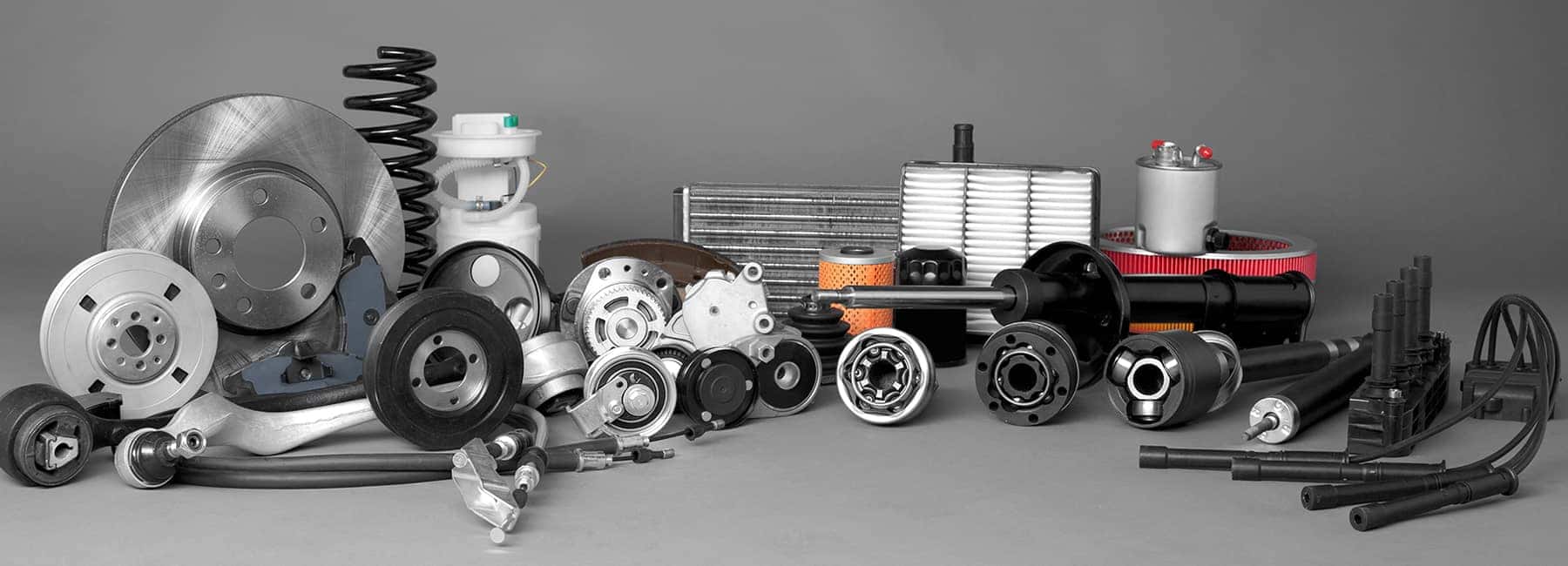 Various Car Parts on Grey Background