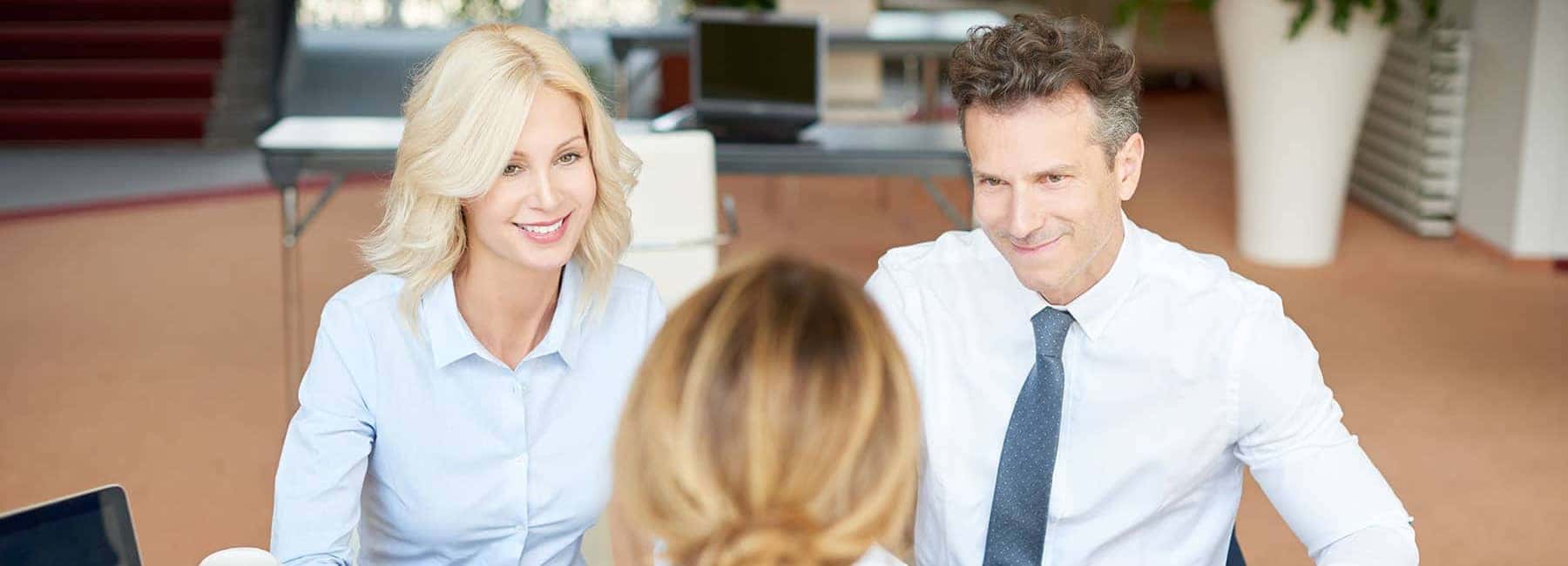 Man and Woman sitting in Finance Office