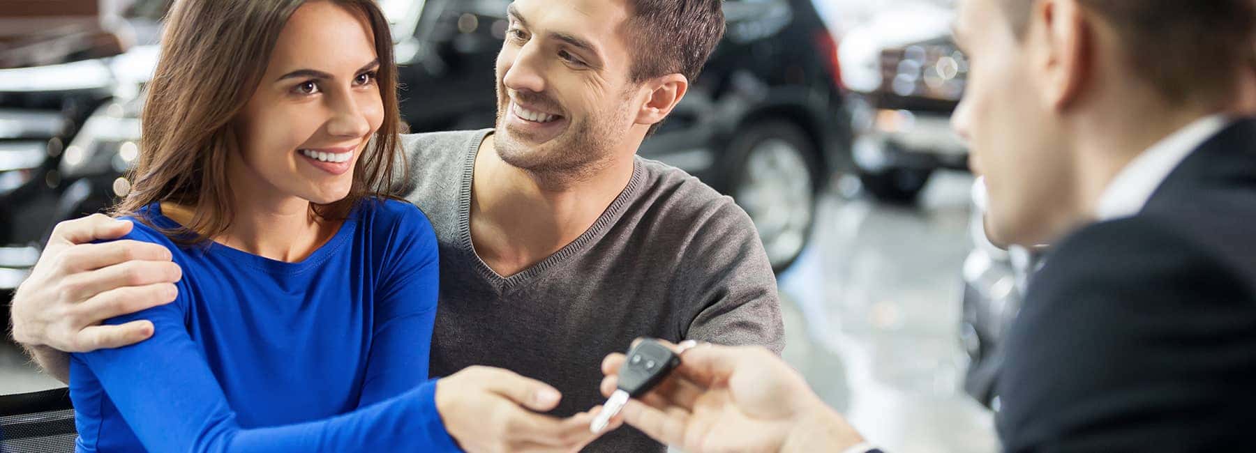Salesman Handing Couple Keys