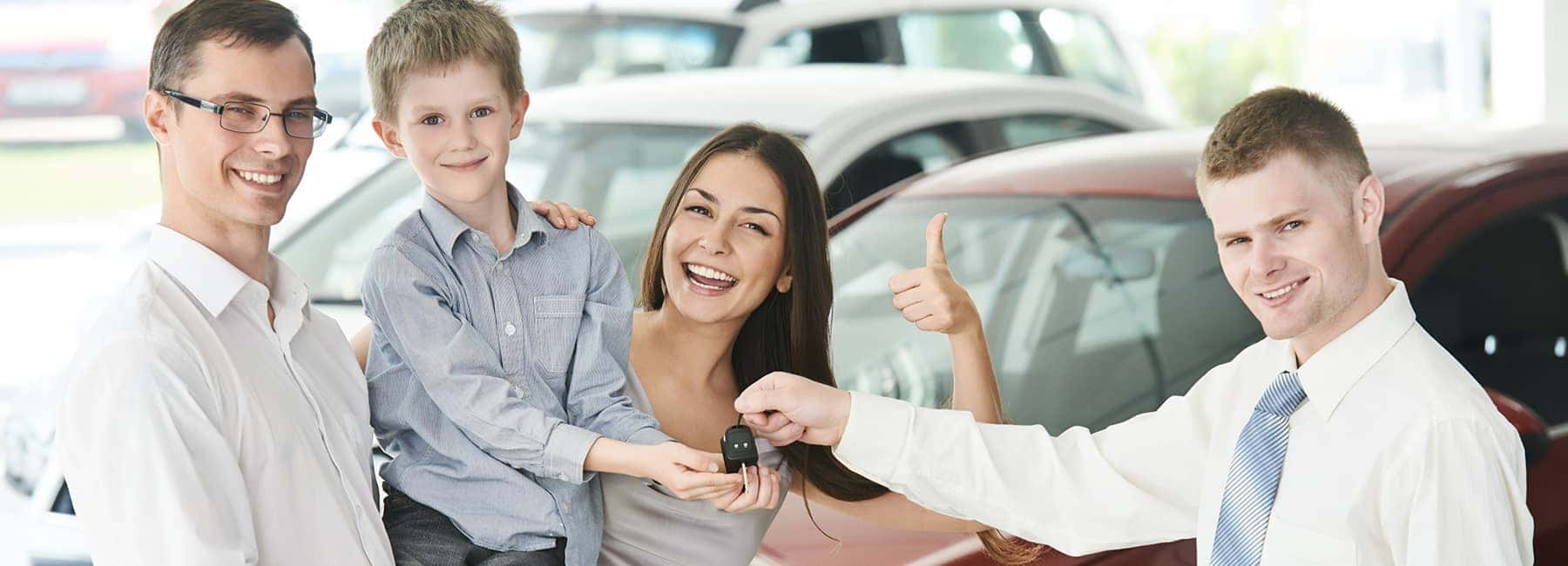 A Happy Family Buying a New Car