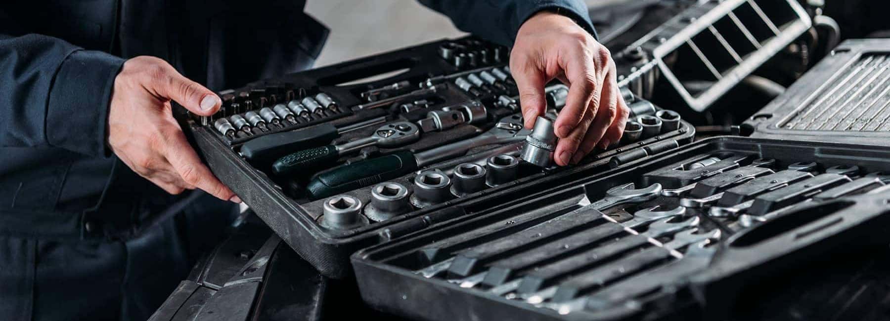 Mechanic Looking at Car Tools