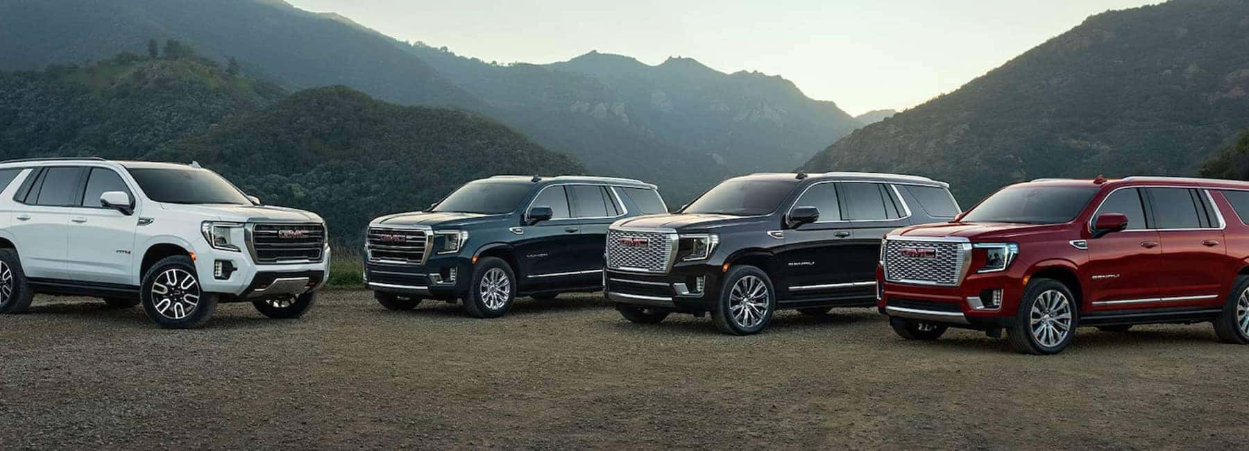 Group of 2023 GMC Yukon SUVs parked in mountains (1)